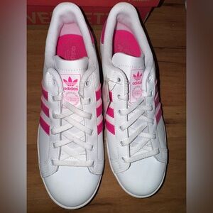 Women’s pink and white adidas